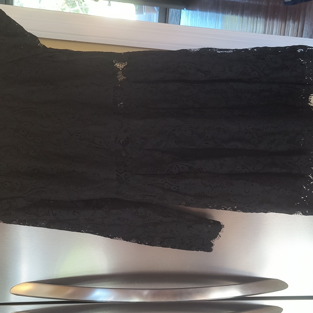 Beautiful fully lined lace dress sz. M see thru ar the waist line never worn new